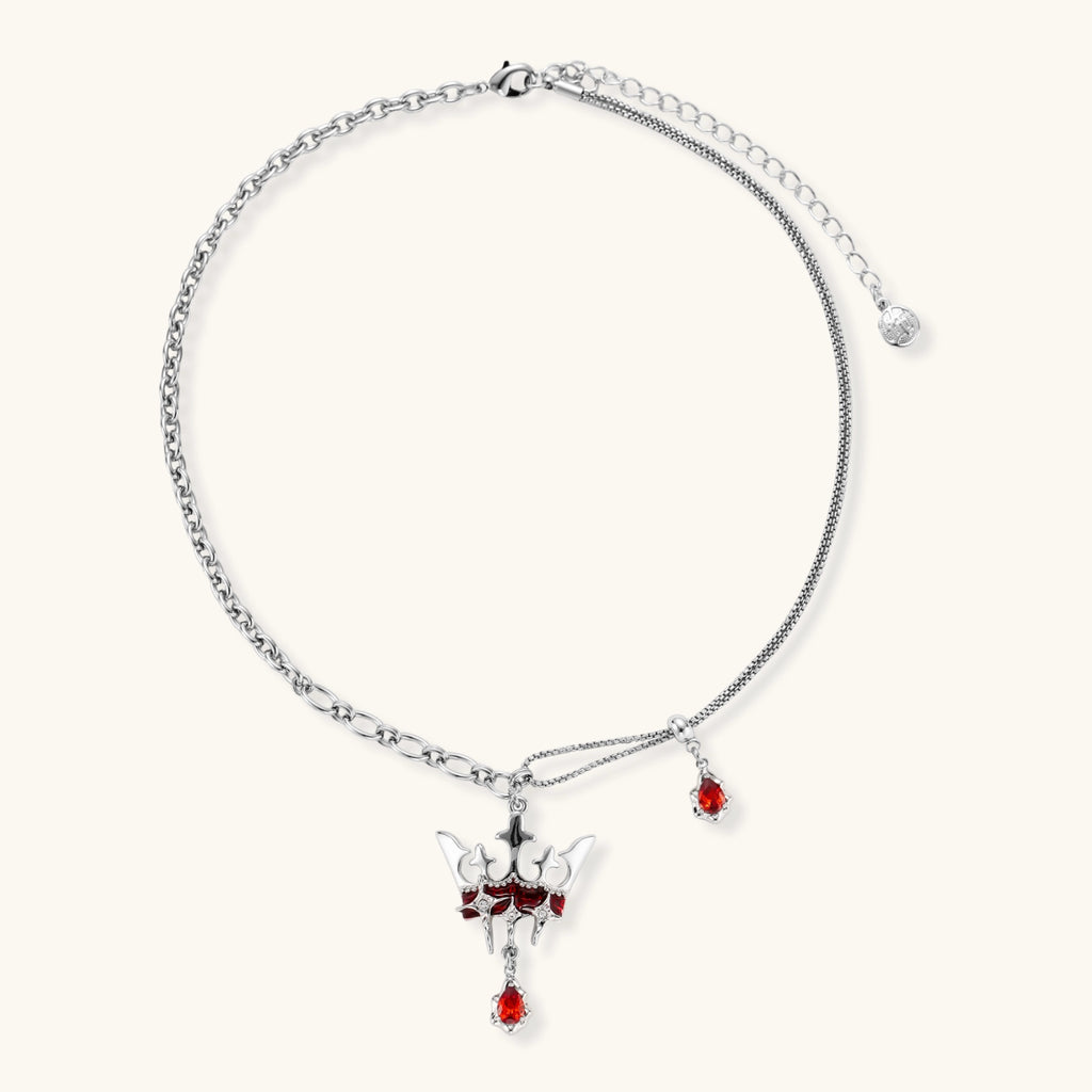 Eco-brass crown pendant necklace with red enamel details and dangling zirconia stone on chunky adjustable chain
