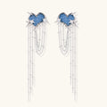 Blue denim cloud-shaped earrings with white gold plated chains, zirconia stars, and cascading silver chain details